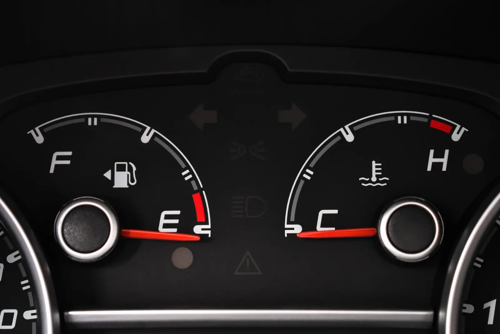 Fuel and engine-temperature gauges in a car instrument cluster